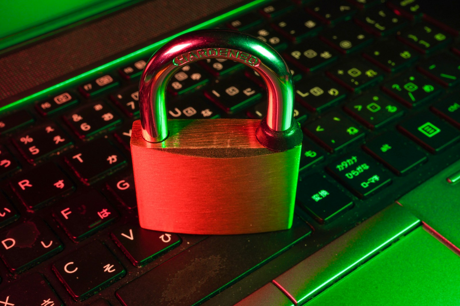 red padlock on black computer keyboard symbolizing personal cyber liability insurance